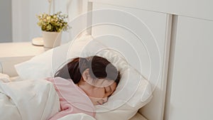 Young Asian girl sleeping at home. Asia japanese woman child kid relax rest asleep lying on bed, feel comfort and calm in bedroom