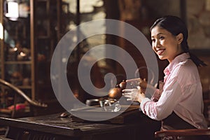 Young asian girl at tea ceremony