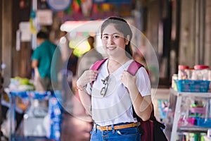 Young asian girl walking at Dumonoe saduak floating market, Thailand