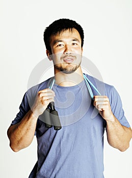 Young asian guy with skipping rope on white background ready to training sport, lifestyle people concept