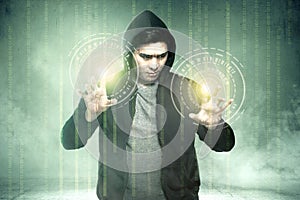 Young asian hacker in black hoodie touching virtual screen with binary code
