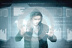 Young asian hacker in black hoodie touching virtual screen