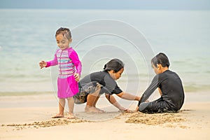 Young asian kids are playing on the beach. Vacation and relax concept