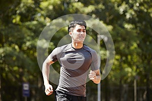 Young asian male athlete running