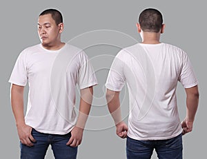 Young Asian male in blank black t-shirt, front and back view, isolated over gray background. Design men shirt mock up template or