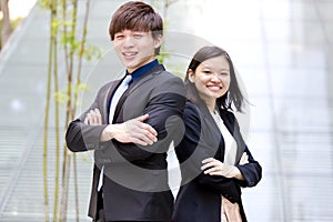 Young Asian male and female business executive smiling portrait