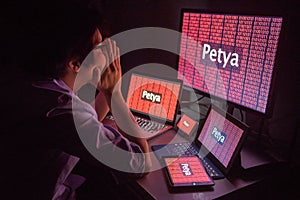 Young Asian male frustrated by Petya ransomware attack