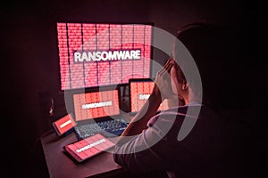 Young Asian male frustrated by ransomware cyber attack