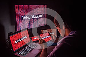 Young Asian male frustrated by ransomware cyber attack photo