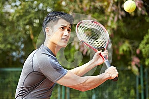 Young asian male tennis player