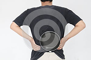 Young Asian man is angry and ready to strike with a frying pan. Indonesia Man wear black shirt Isolated grey background