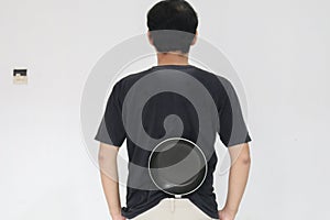 Young Asian man is angry and ready to strike with a frying pan. Indonesia Man wear black shirt Isolated grey background