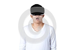 Young asian man in casual white outfit holding or wearing VR glasses watching video