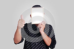 Young Asian Man Covering His Face With Small Whiteboard