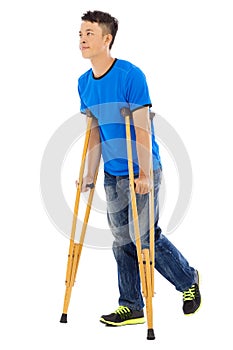 Young asian man on crutches.