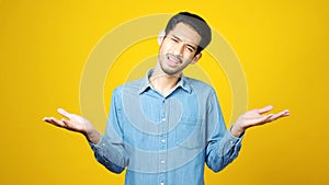 Young asian man doubting while standing over isolated yellow background, Portrait of confused handsome asia guy, People negative
