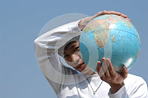 Young Asian Man with a Globe