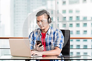 Young asian man having video conference