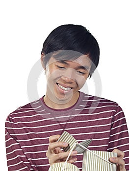 Young Asian man holding gift box