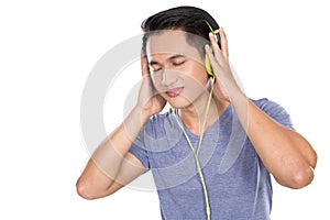 Young asian man listening to music with a headset