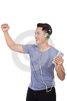 Young asian man listening to music with a headset