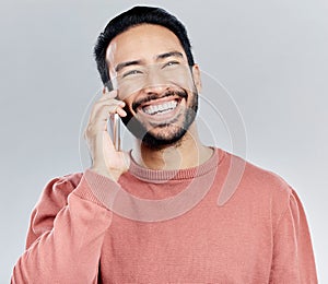 Young asian man, phone call and happy in studio for communication, networking and gray background. Student male model