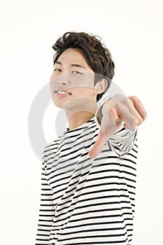 Young asian man pointing at you