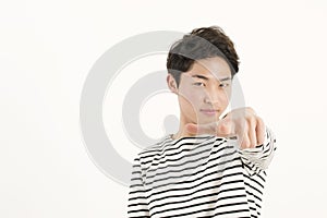 Young asian man pointing at you