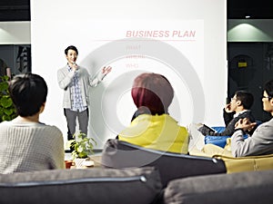 Young asian man presenting business plan