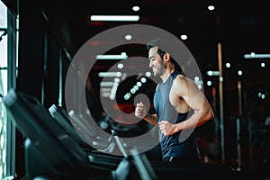 Young Asian Man Running on Treadmill