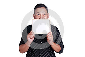 Young Asian Man Showing Small Whiteboard Covering His Face