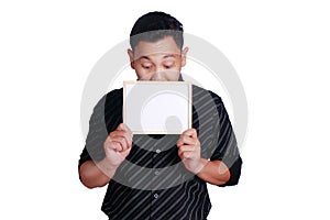 Young Asian Man Showing Small Whiteboard Covering His Face