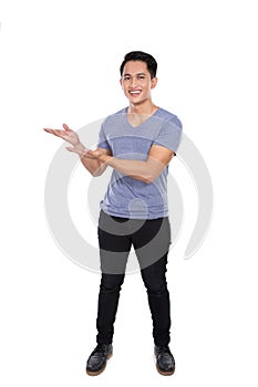 Young asian man smile to the camera, prensenting hand gesture