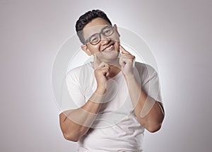 Young Asian Man Smiling Happily