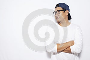 Young Asian Man Smiling Happily, Looking to the Side