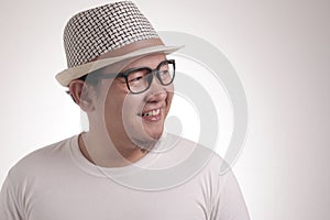 Young Asian Man Smiling Happily, Looking to the Side