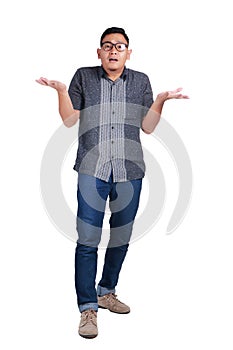 Young Asian Man Standing Wearing Batik Shirt, Shrug Gesture