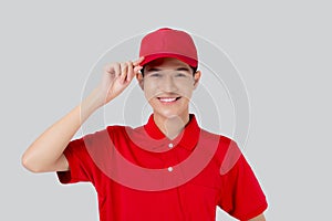 Young asian man in uniform and red cap standing and catch a hat with confident isolated white background.