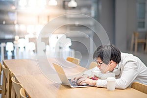 Young Asian man university student doing homework