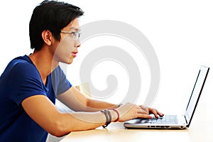 Young asian man using laptop