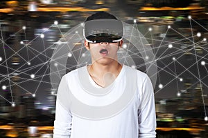 Young asian man with virtual reality goggles