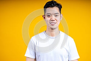 Young Asian man wearing posting isolate on yellow background