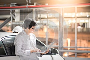 Young Asian mechanical engineer working with laptop