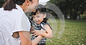Young Asian mother hold cute daughter with smile. Mom kid love relationship or happy child girl concept with copy space