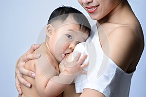 Young asian mother holding her baby and breast feeding baby