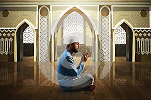 Young asian muslim man with beard pray in the mosque