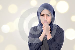 Young asian muslim woman with hopefull expression