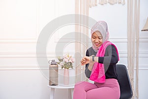 Young Asian muslim woman preparing for workout