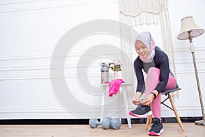 Young Asian muslim woman preparing for workout