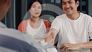 Young Asian Pregnant couple sign contract documents at home, Japanese family consulting with real estate financial advisor, Buying